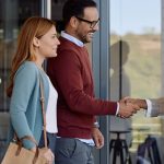 Couple meeting their listing agent at office, San Jose, CA